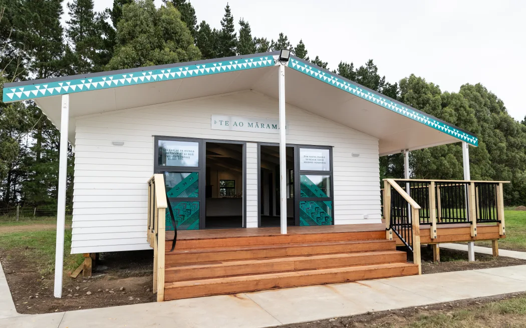 Te Ao Mārama whare manaaki exterior - tāniko maihi and entry steps
